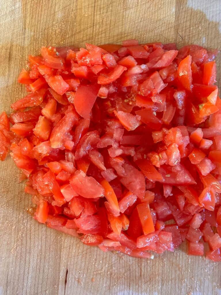diced tomatoes on a cutting board