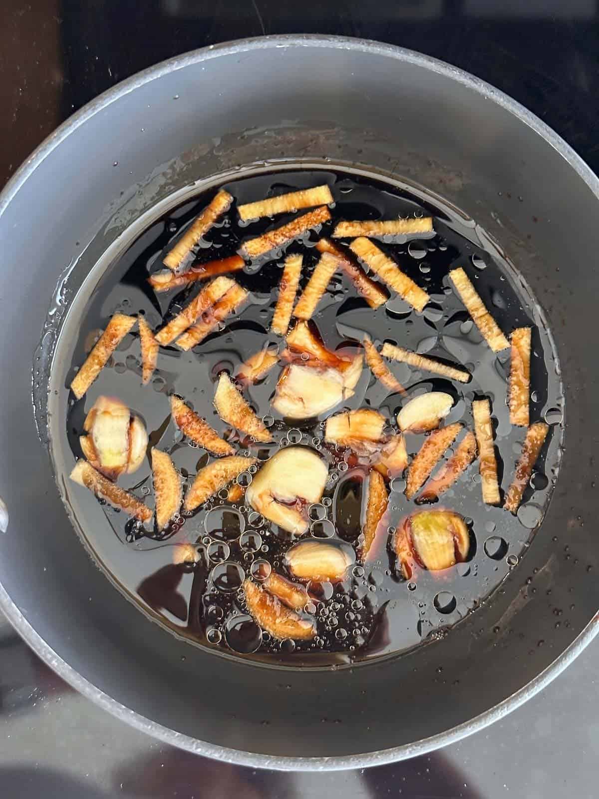 shoyu broth in a sauce pan