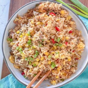 hawaiian pork fried rice made with smoked kalua pork served in a bowl with chopsticks