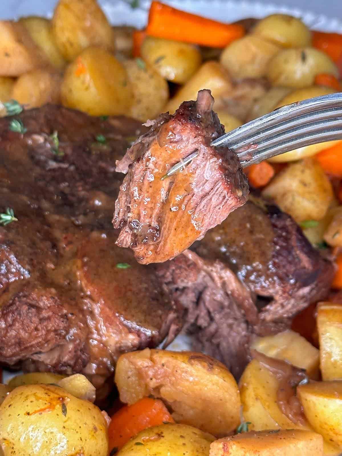 tender and juicy pot roast with carrots and potatoes