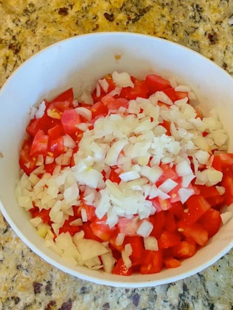 Diced tomato and Hawaiian sweet onion in a bowl