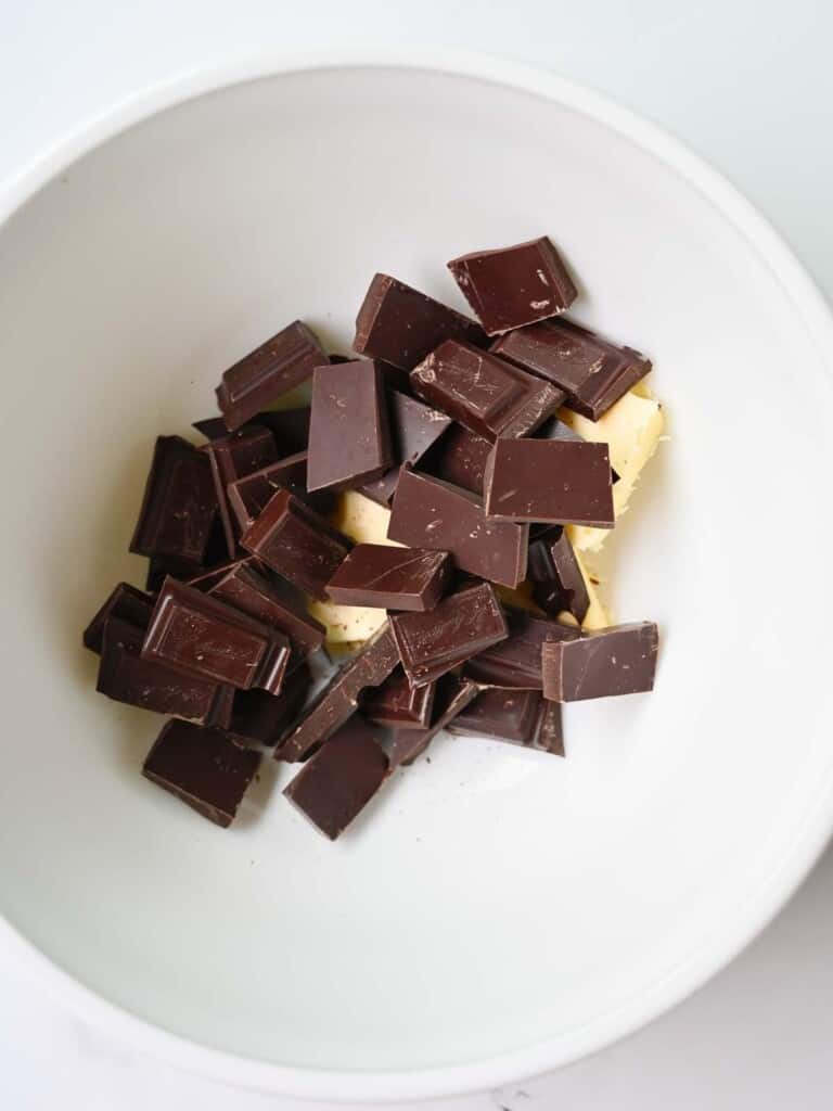 butter and baking chocolate in a medium glass bowl