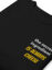 black folded sweatshirt with "cheese is always the secret ingredient" close up