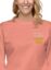 woman wearing salmon pink sweatshirt with "cheese is always the secret ingredient"