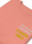 salmon pink folded sweatshirt with "cheese is always the secret ingredient" close up
