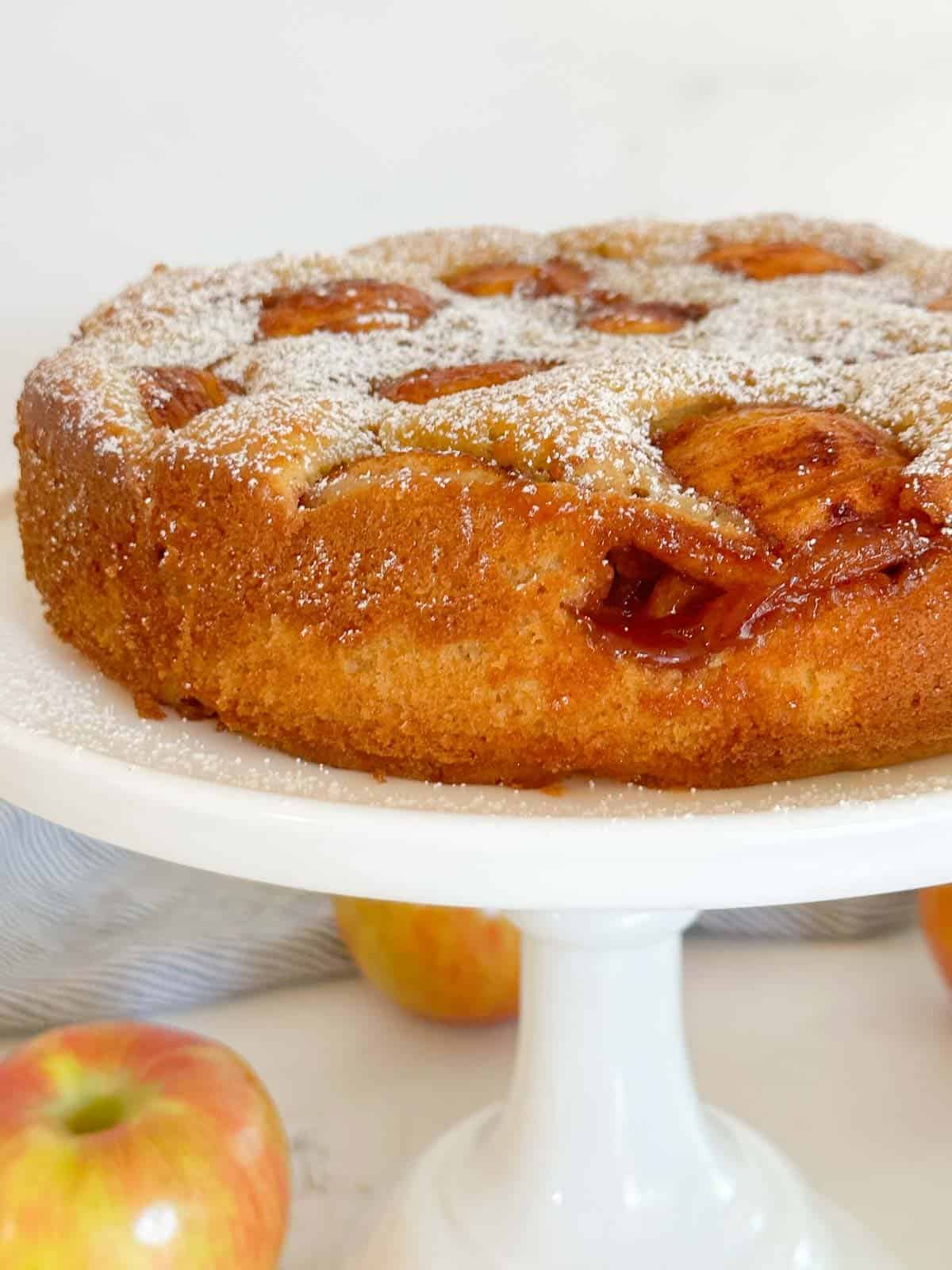 german apple cake on a white cakstand