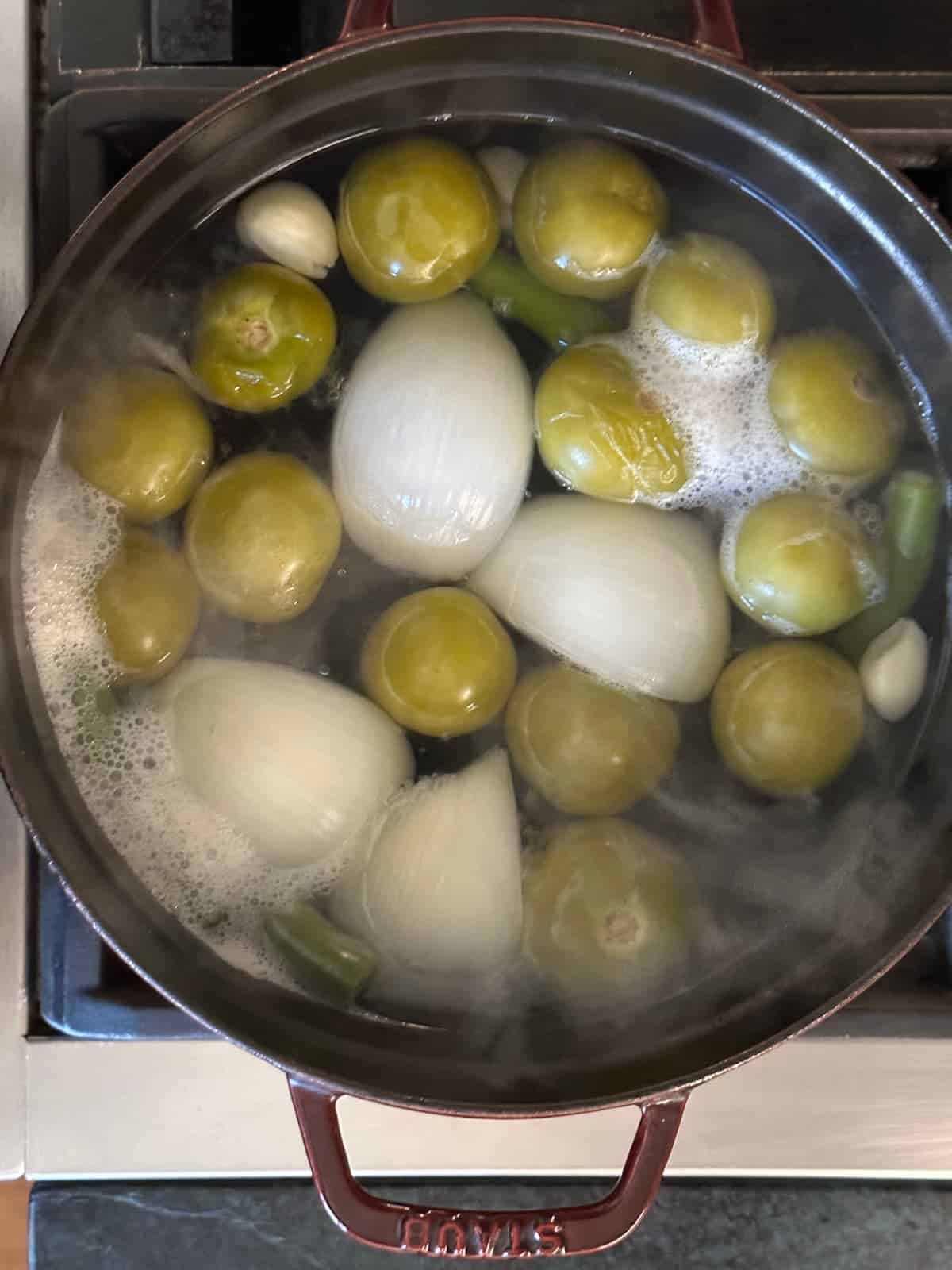 salsa verde ingredients in a large pot after 10 minutes of boiling.