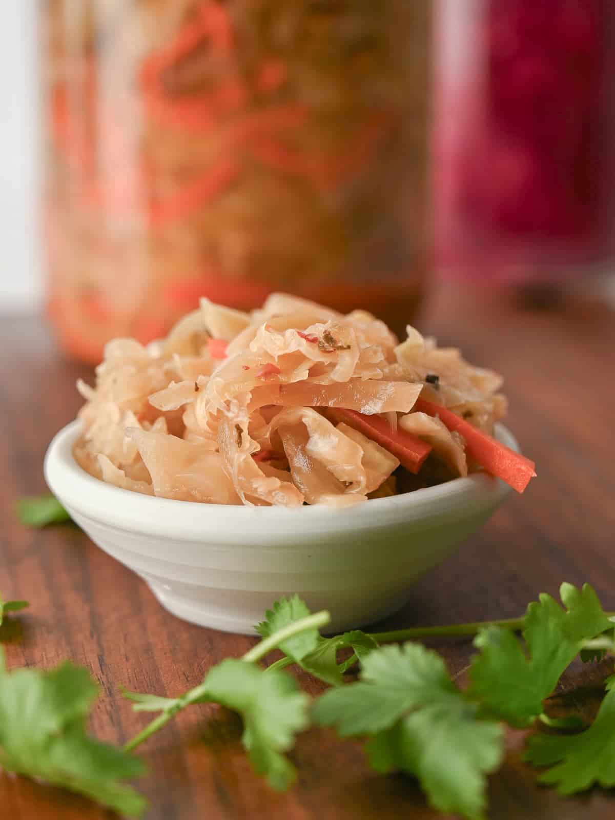 homemade curtido in a small white bowl