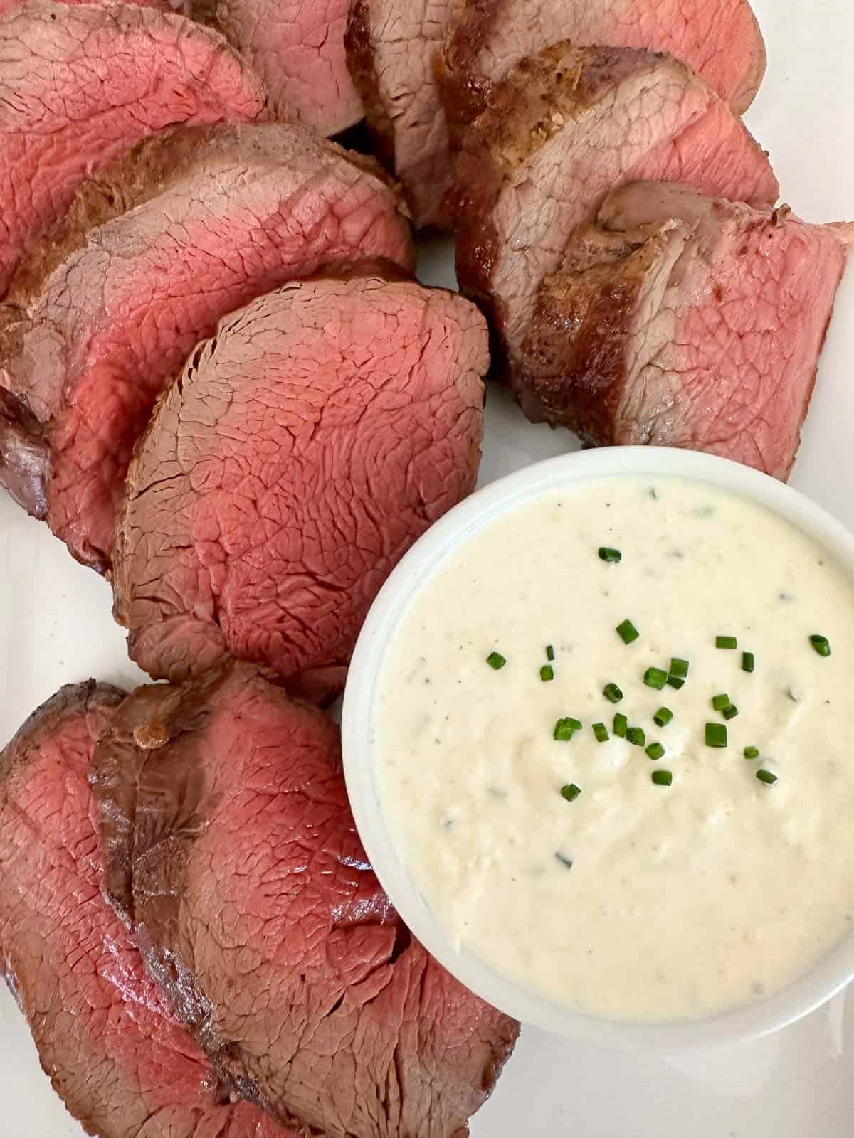 Slow roasted beef tenderloin served with horseradish cream sauce
