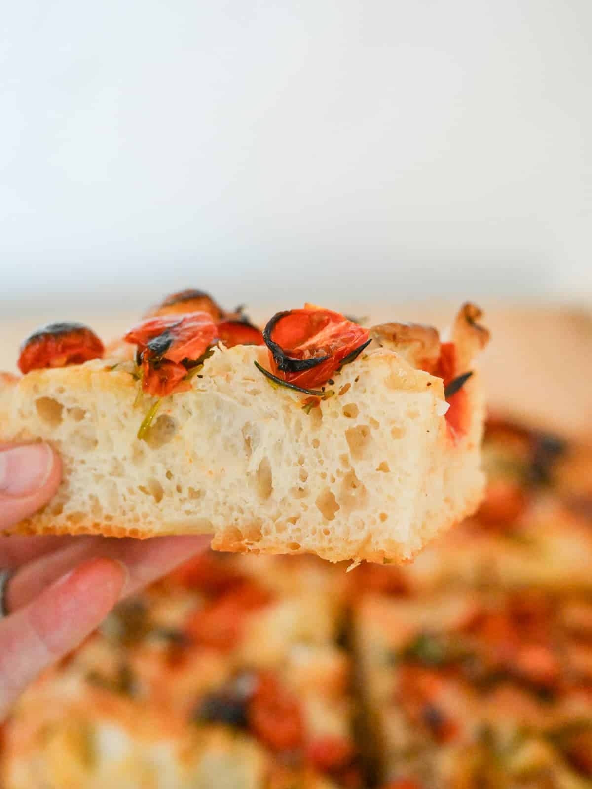 a view of the inside texture of tomato focaccia bread