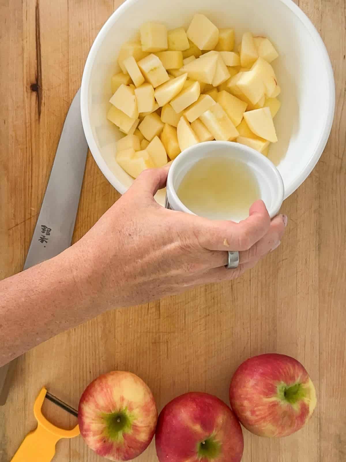 add lemon juice to the diced apples