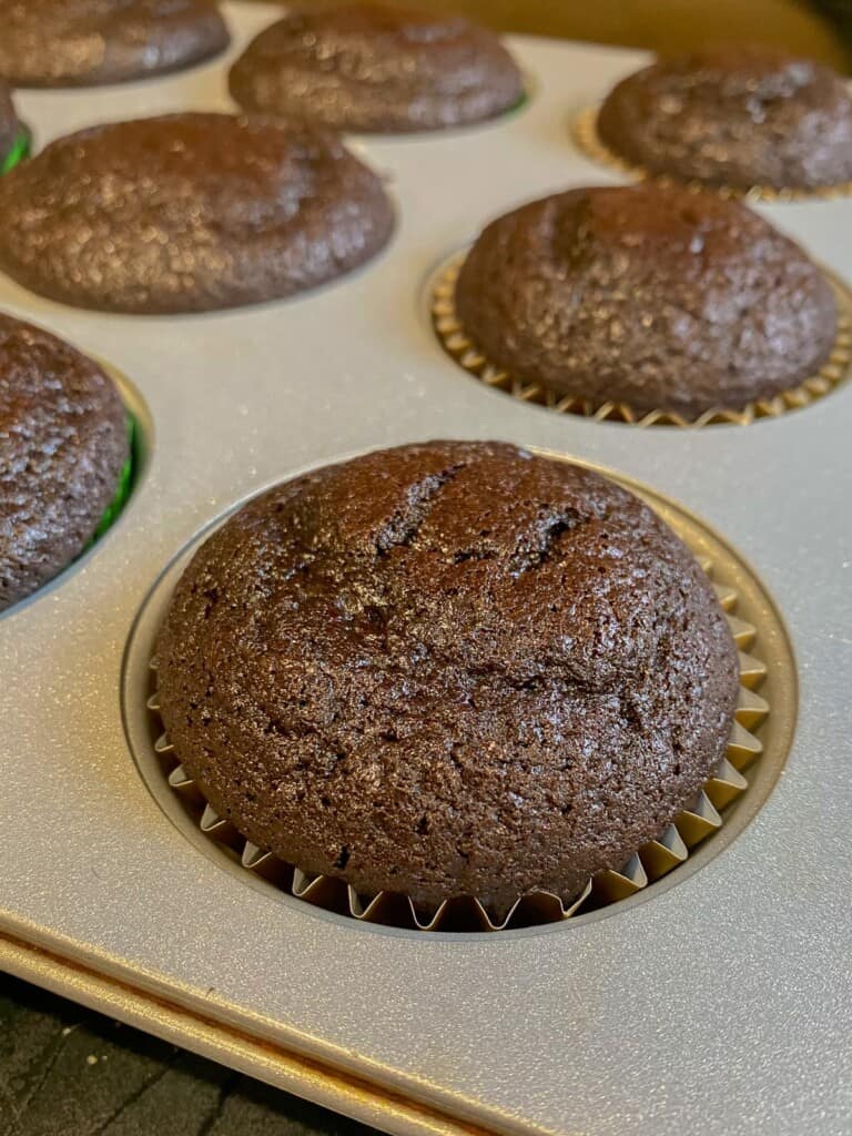 close up of a fully baked devils food cupcake