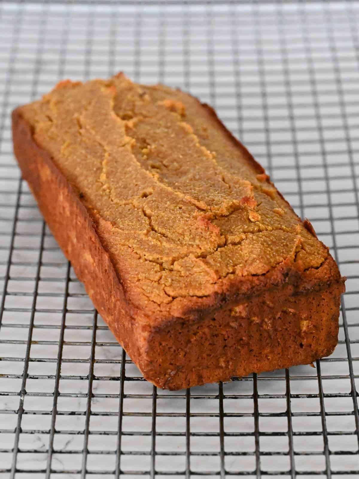 pumpkin bread cooling on a wire baking rack