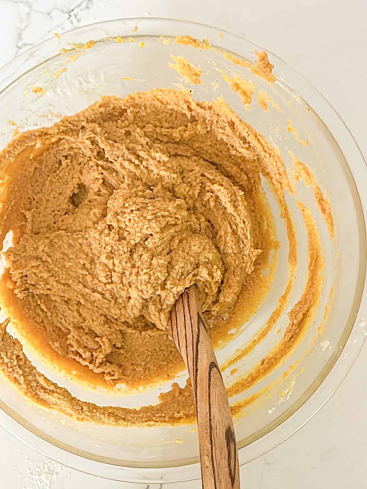 batter for gluten free pumpkin bread in a large mixing bowl; stirred with a wooden spoon