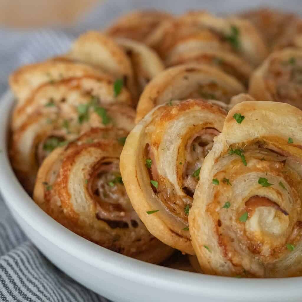 the best ham and cheese pinwheel appetizer in a bowl