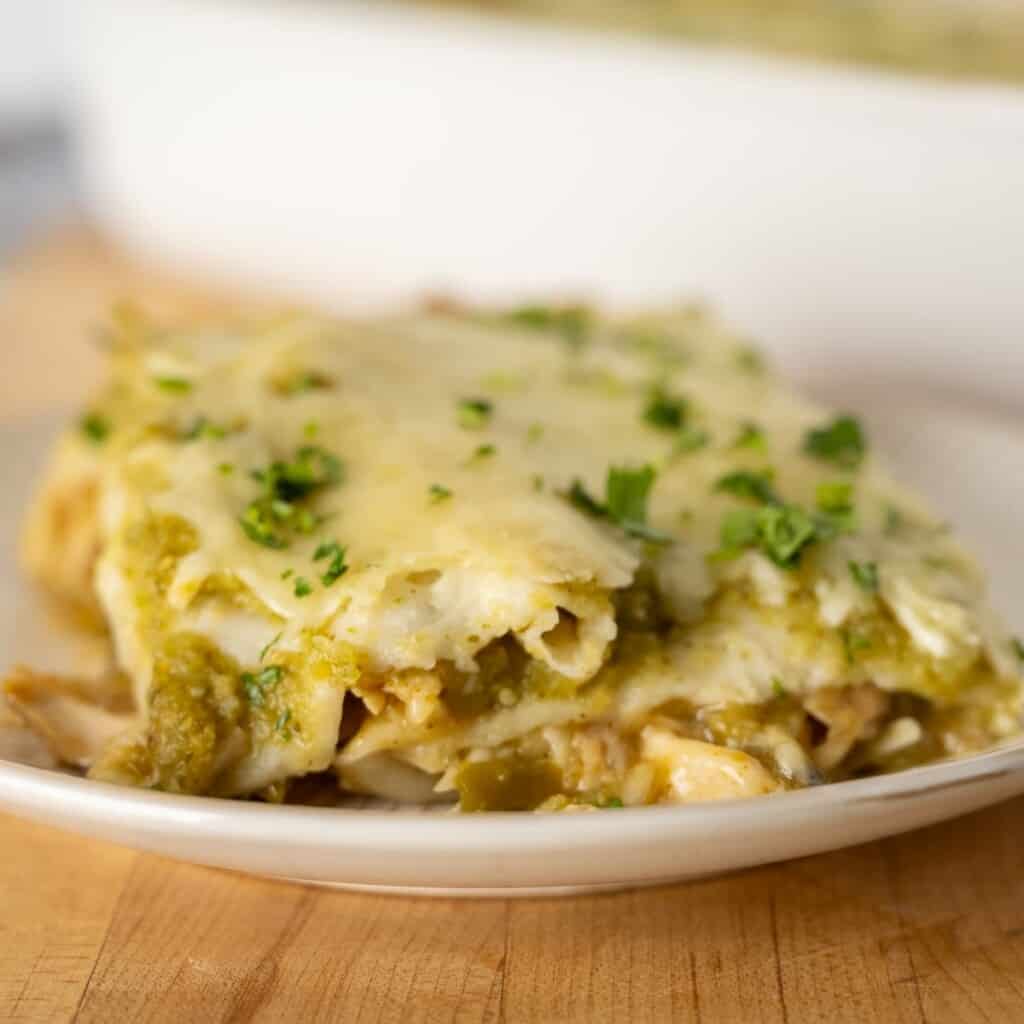 a serving of enchiladas verde topped with fresh cilantro