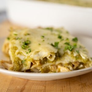 a serving of enchiladas verde topped with fresh cilantro