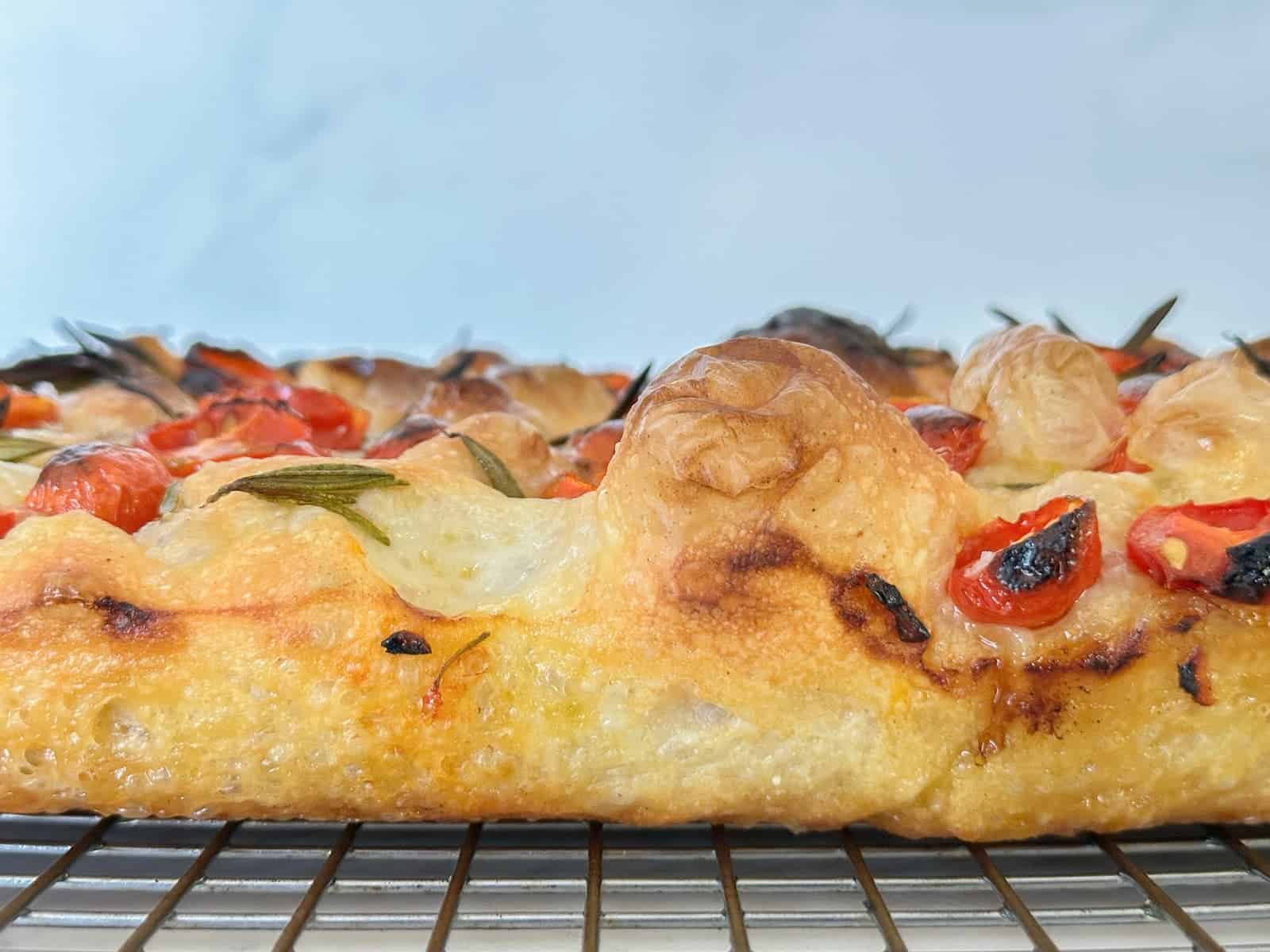 focaccia bread on a wire baking rack