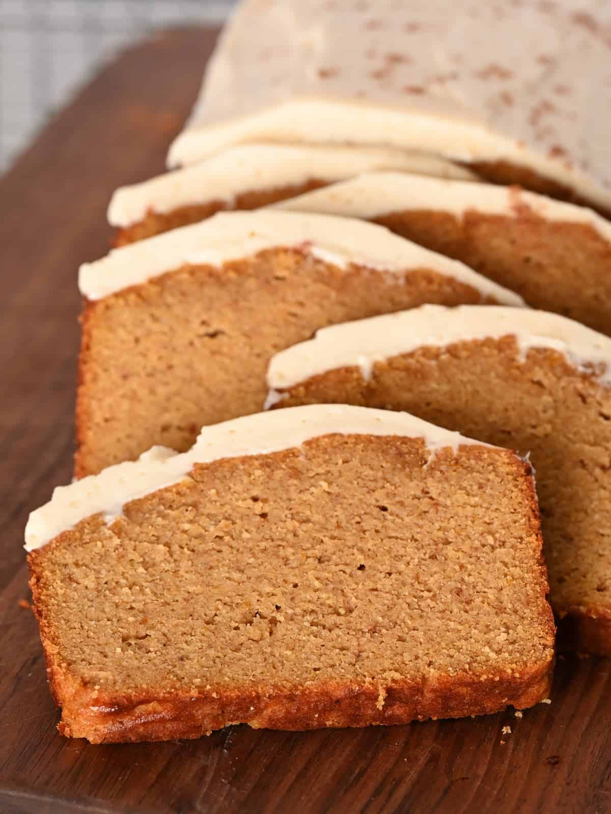 sliced gluten free pumpkin bread with. cream cheese frosting