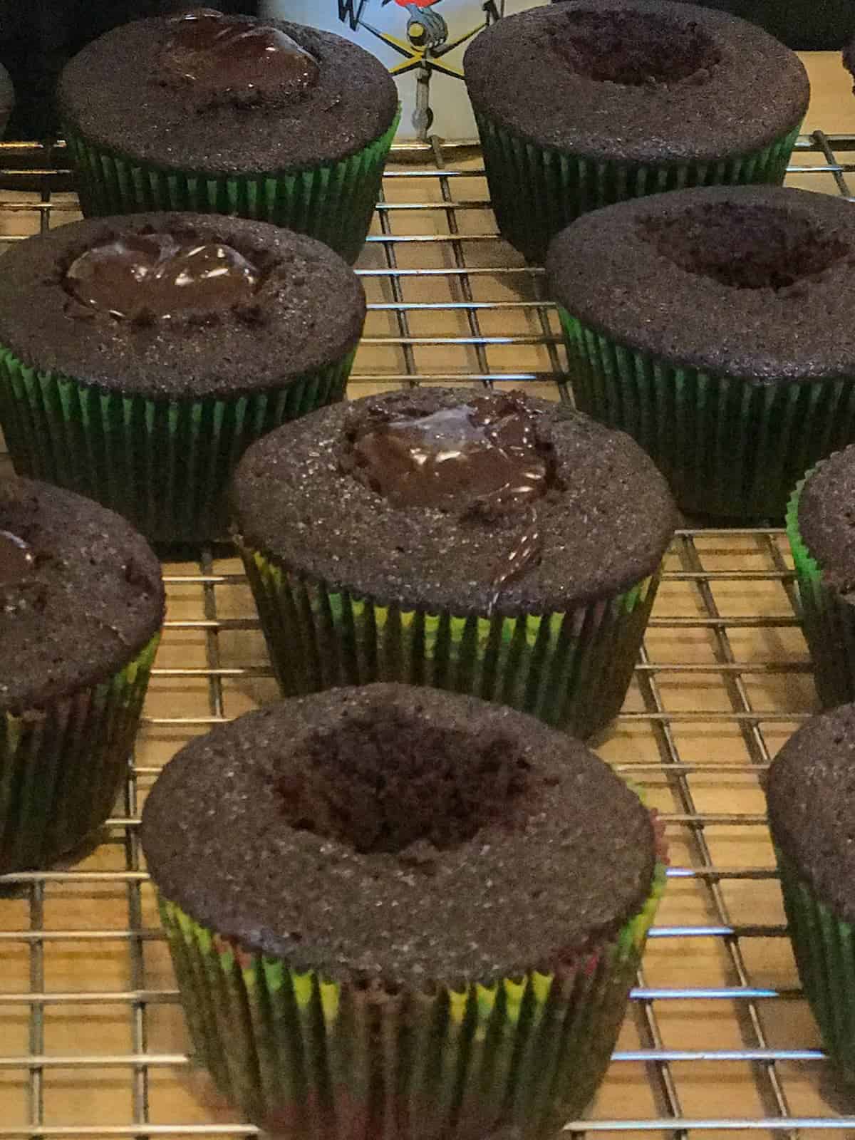 devils food cupcakes with the cores cut out
