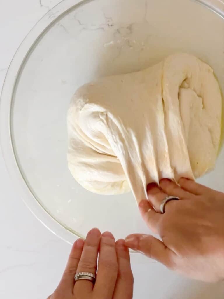 demonstration of the second turn in the pull and turn method of bread folding, often used with no knead bread recipes