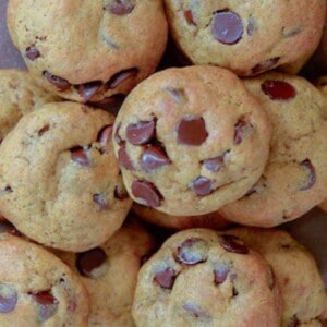 a stack of freshly baked pumpkin chocolate chip cookies