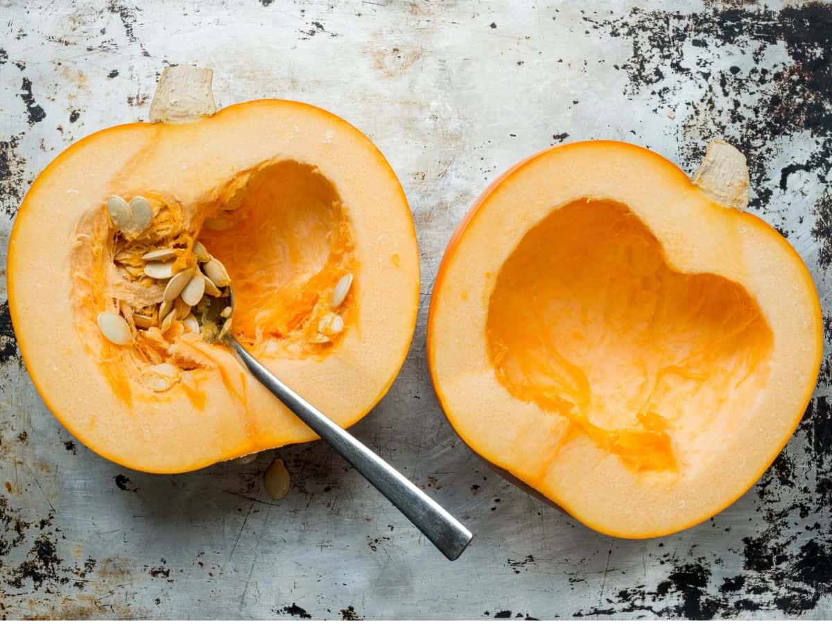 remove the seeds out of the pumpkin with a spoon