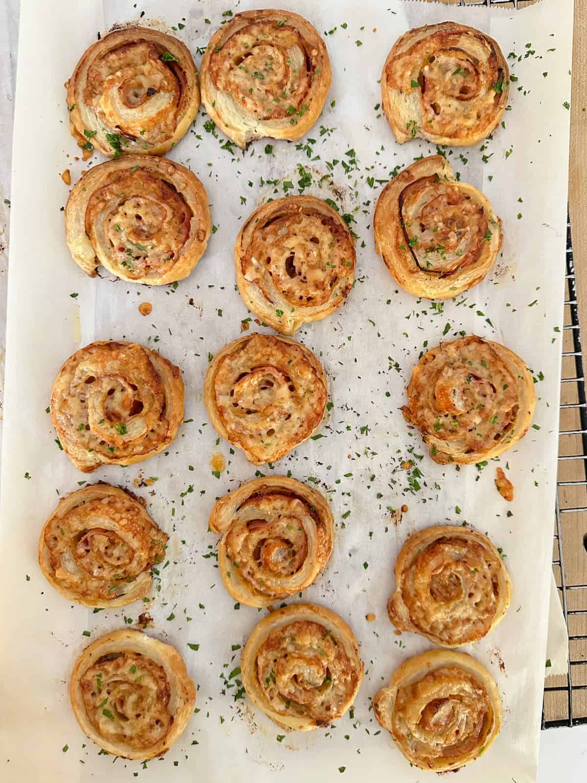 golden brown pinwheels sprinkles with fresh parsley