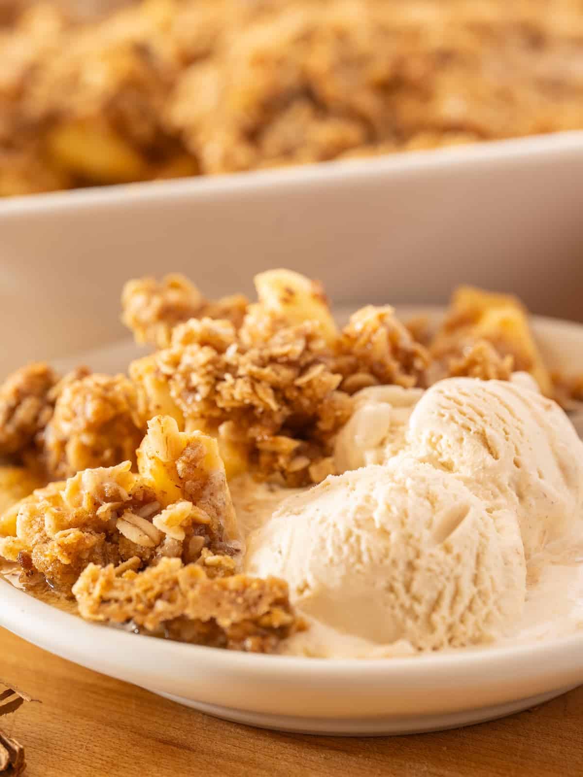 delicious apple crisp with melting ice cream