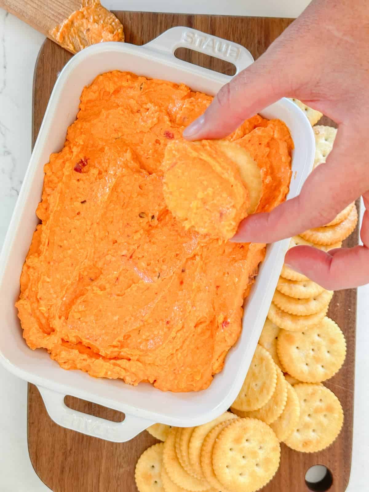 pimento cheese with cheese spread on a ritz cracker