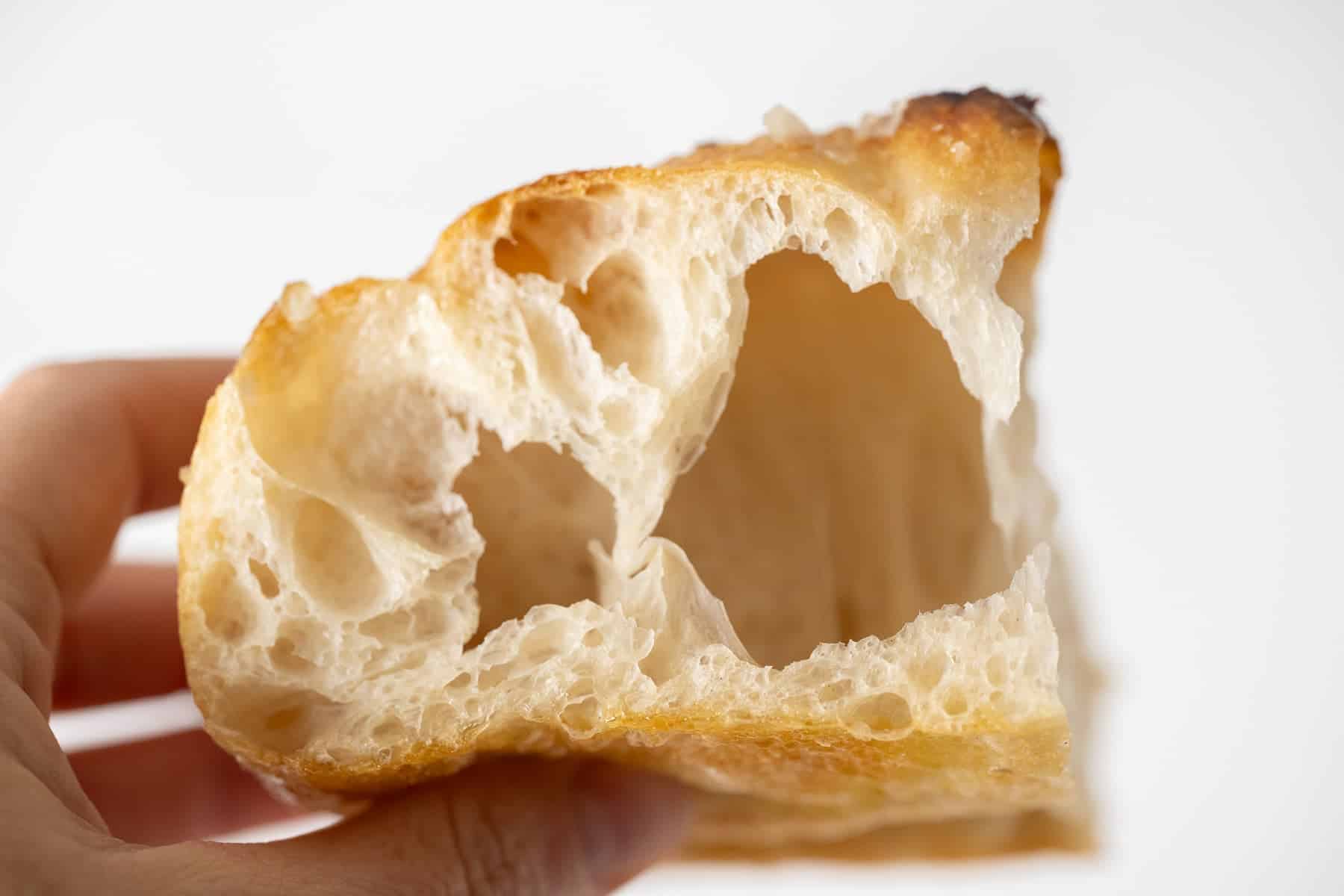 close up of the inside of focaccia bread showing the pillowy texture