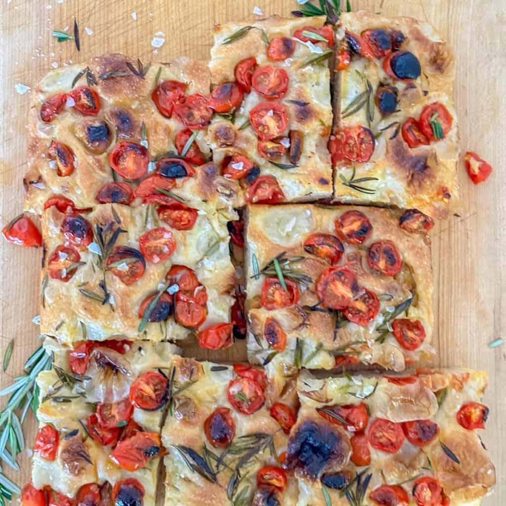 tomato focaccia sliced into big square pieces for serving