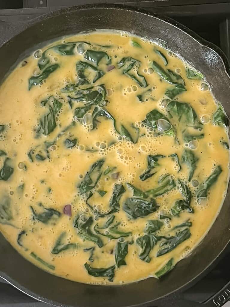 eggs added to the spinach and onions