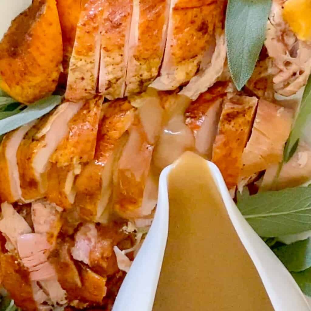 sliced turkey slathered with turkey gravy