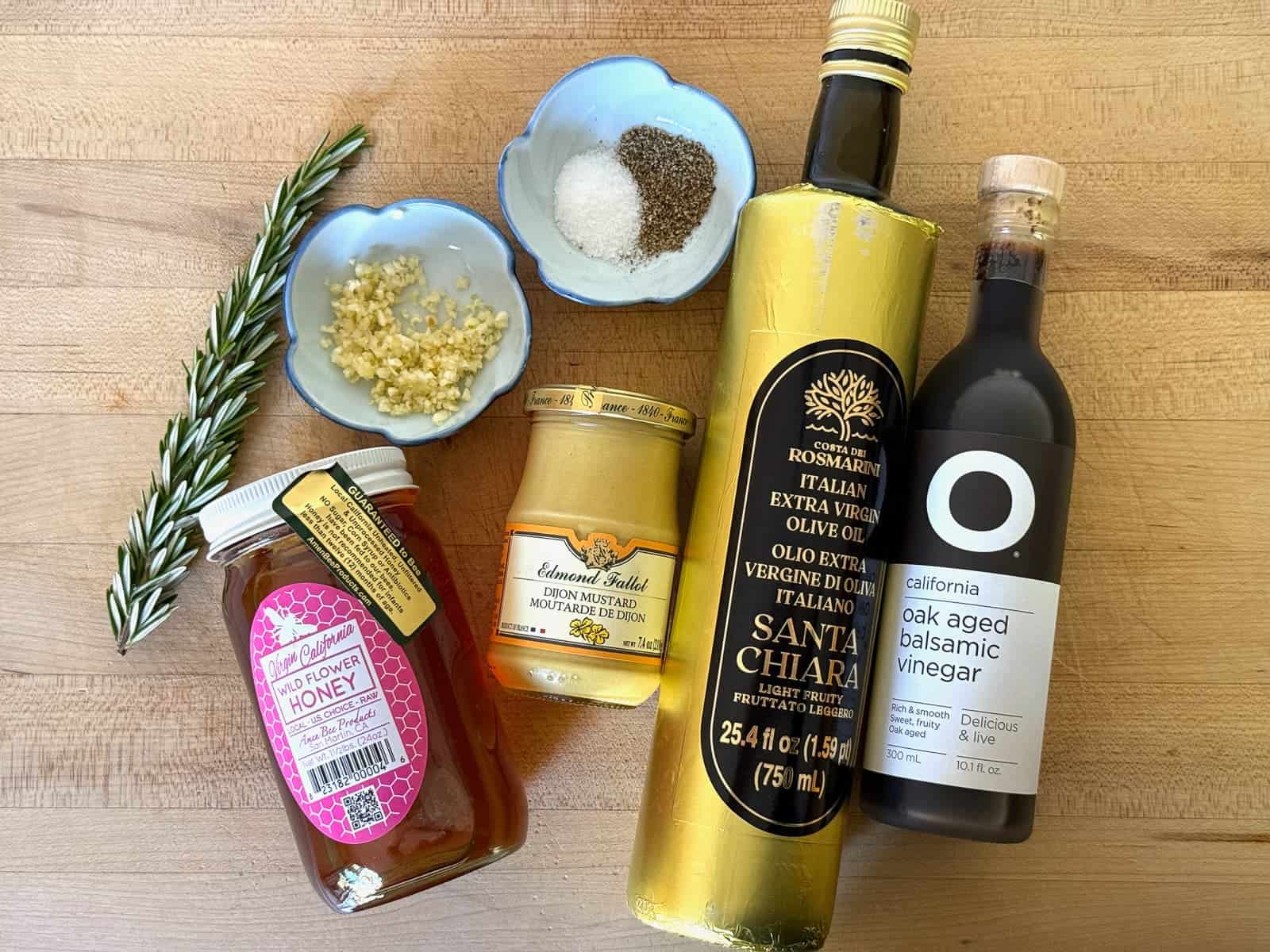 ingredients for balsamic dressing; olive oil, balsamic vinegar, dijon mustard, garlic, honey, salt and pepper, fresh herbs (optional)