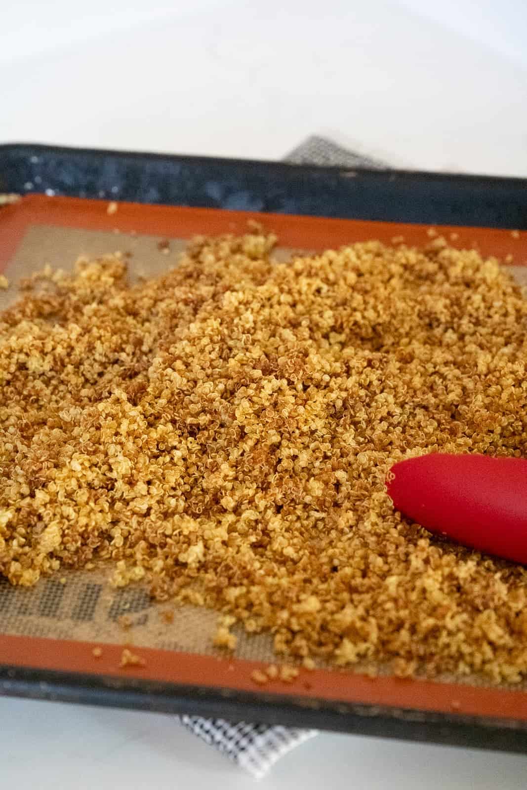 a baking sheet of crispy quinoa