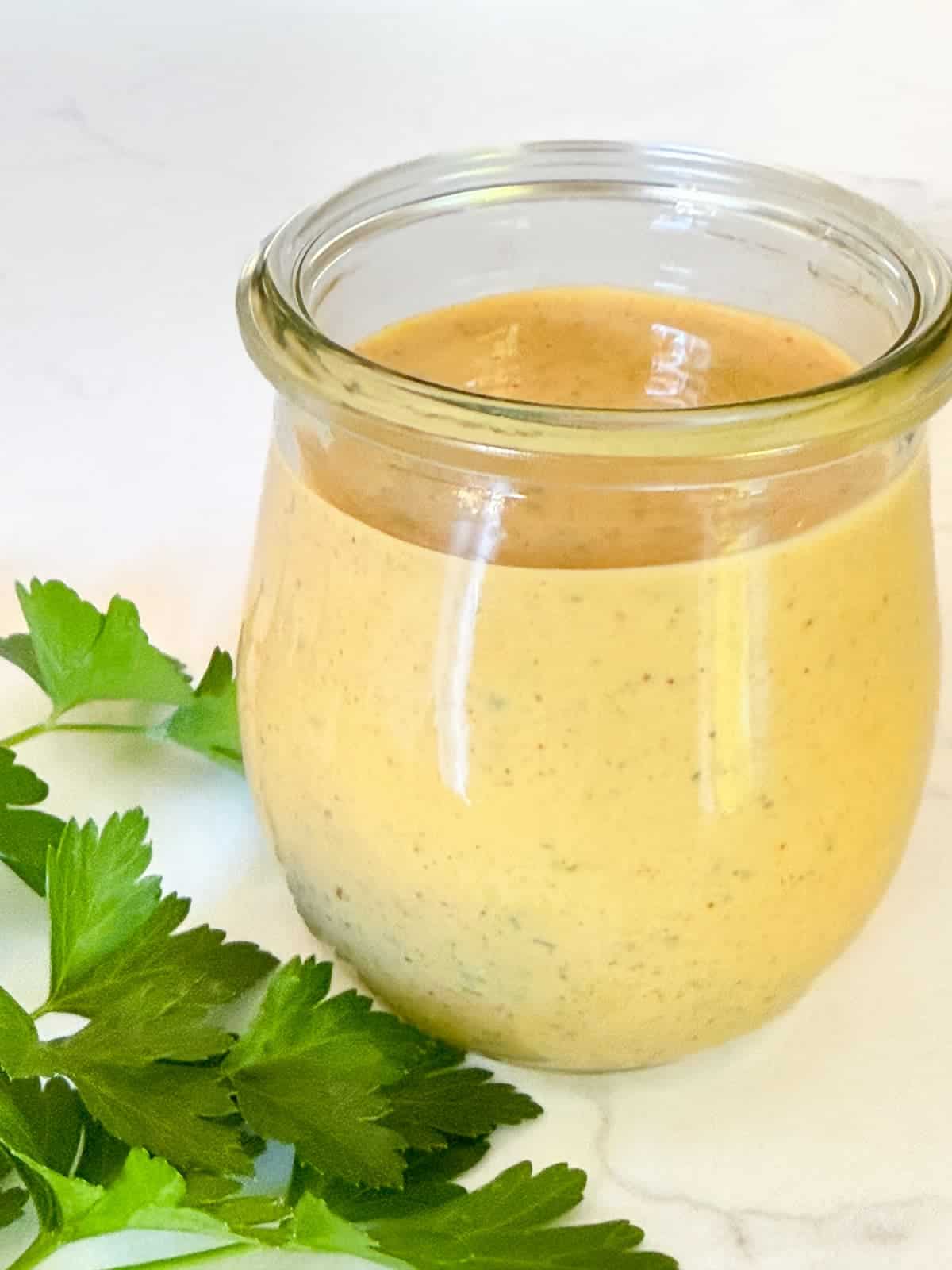 creamy buffalo ranch dressing in a small weck jar