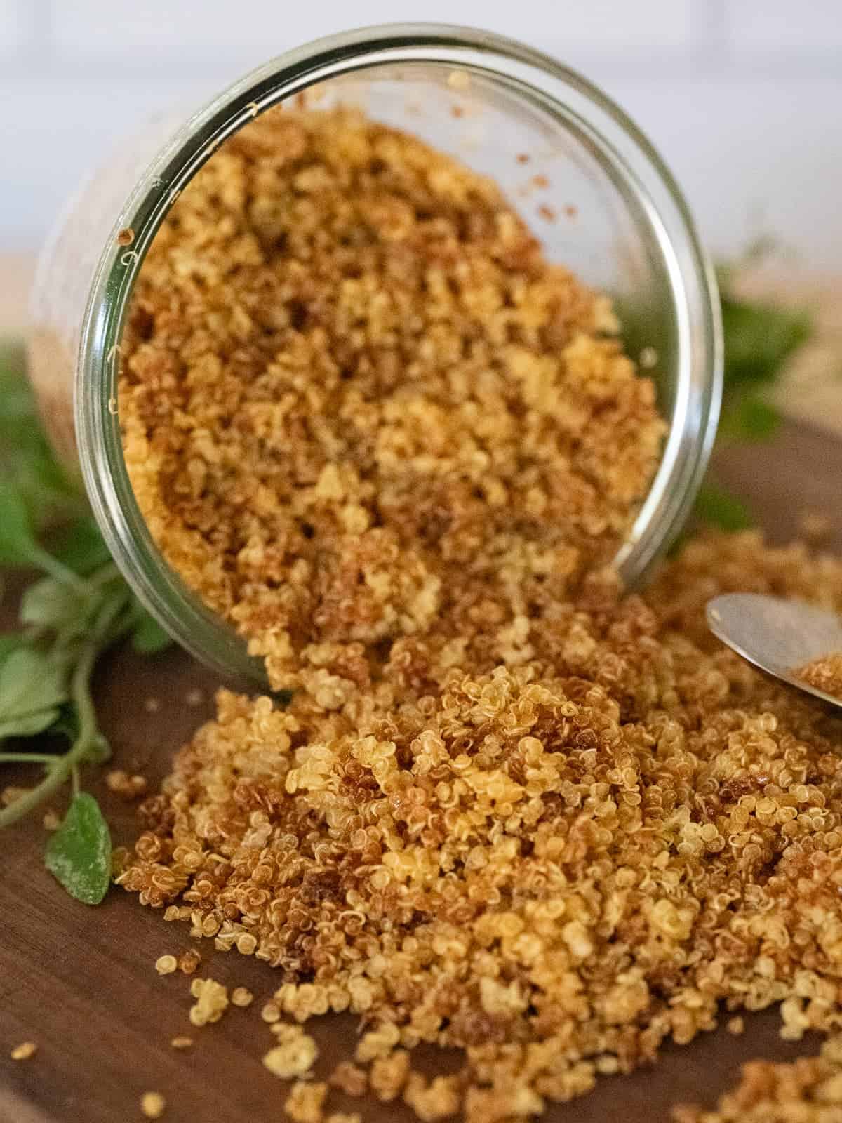 a spilled jar of homemade crispy quinoa