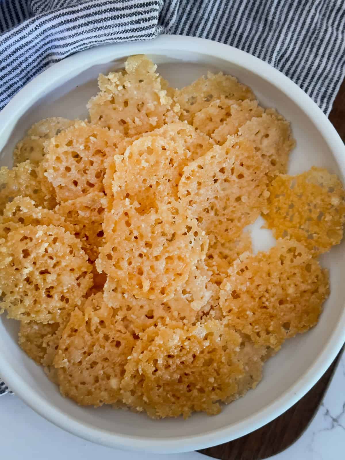 a bowl of freshly baked cheese crisps ready snacking