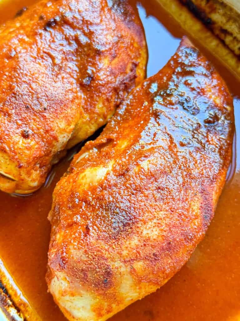 buffalo chicken breasts in a baking pan