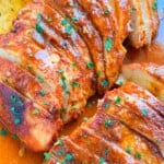 baked buffalo chicken breasts sliced in a pan
