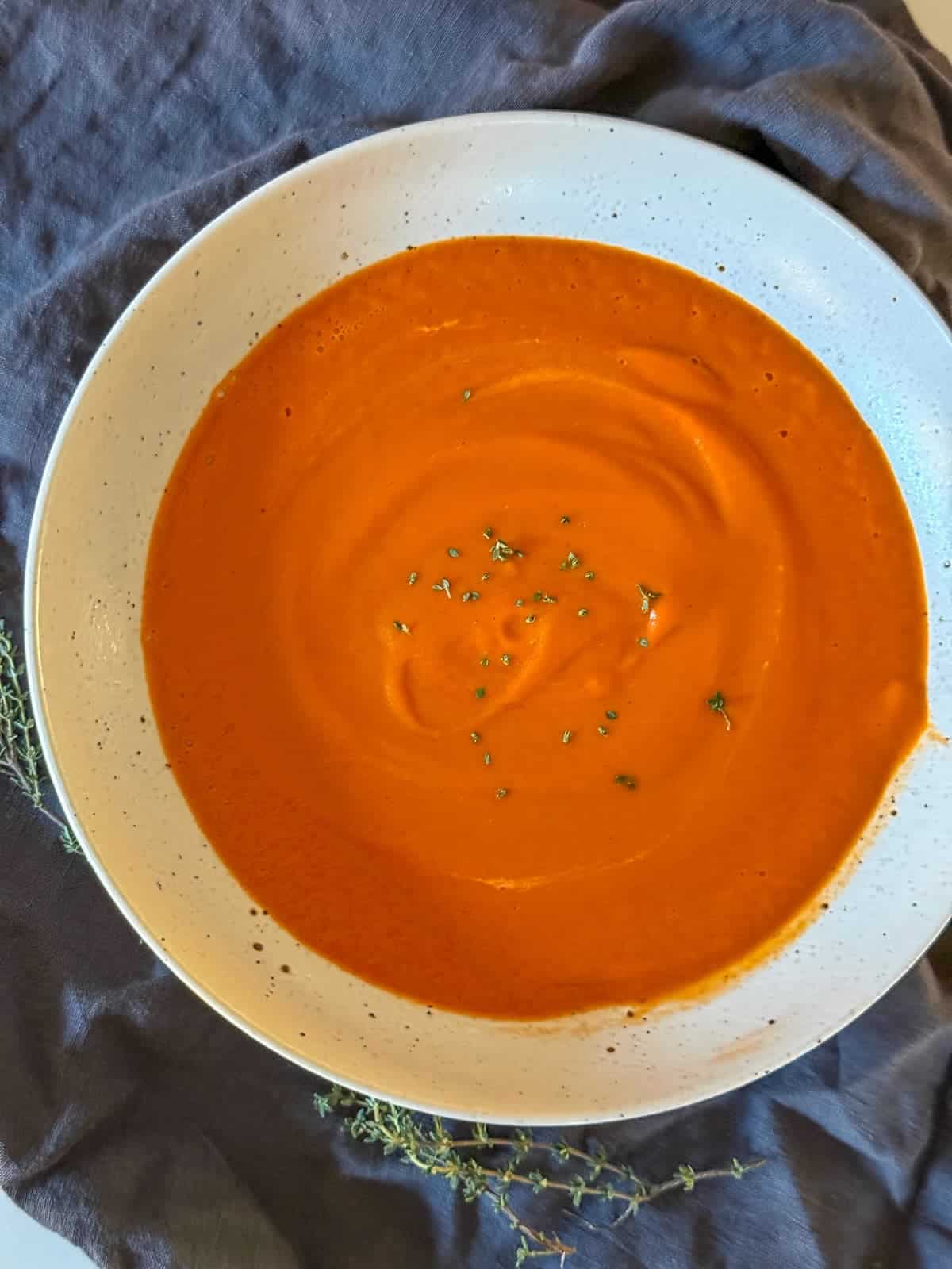 A bowl of homemade creamy tomato soup is a bowl
