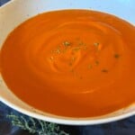 close up shot of bowl of creamy homemade tomato soup