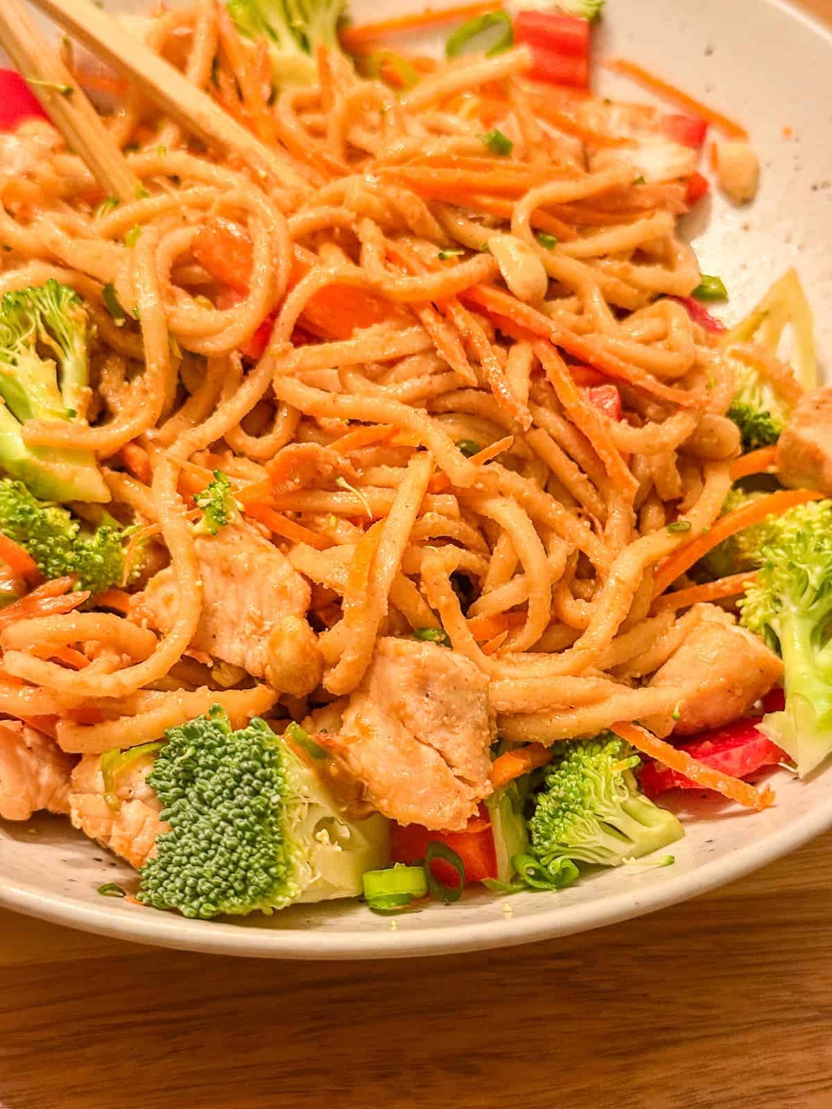 thai inspired peanut noodles with veggies and a creamy peanut sauce